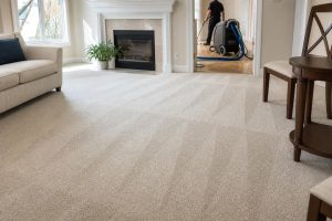 Freshly cleaned carpet in McLean home with furniture moved aside and professional cleaning equipment nearby